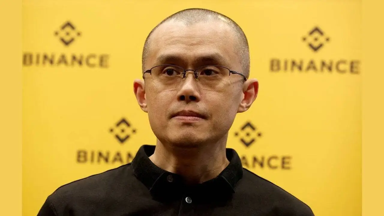 Changpeng Zhao (CZ) της Binance μπροστά σε κόκκινα γραφήματα αγοράς crypto μετά το crash της 10ης Οκτωβρίου και τις μαζικές ρευστοποιήσεις