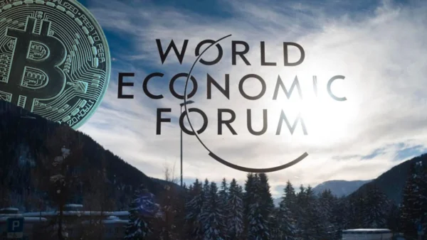 Bitcoin discussed as an anti-dollar hedge during the World Economic Forum in Davos 2026 amid global economic uncertainty